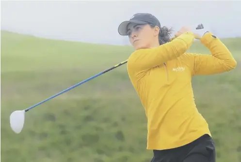  ??  ?? North Berwick’s Clara Young tees off on her way to a semi-final victory over Jennifer Saxton (Muckhart) at Royal Aberdeen.