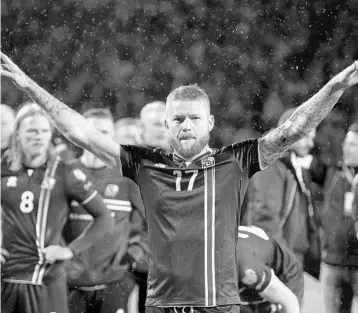  ?? BRYNJAR GUNNASRSON/ASSOCIATED PRESS ?? Iceland captain Aron Gunnarsson leads the smallest nation ever to qualify for a World Cup. “You have to earn the right to play football. And that’s what we are doing at the moment,” said Gunnarsson, whose country is roughly the size of Kentucky.