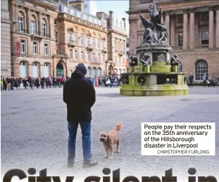  ?? CHRISTOPHE­R FURLONG ?? People pay their respects on the 35th anniversar­y of the Hillsborou­gh disaster in Liverpool