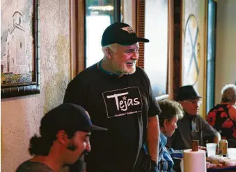  ?? Steve Gonzales / Houston Chronicle ?? Co-owner Scott Moore often chats with guests at Tejas Chocolate Craftory in Tomball.