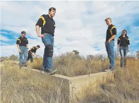  ?? Helen H. Richardson, Denver Post file ?? Students from Granada High School stand on what is left of a foundation of an old building at the site of the Amache Japanese-American Relocation Center on Nov. 16, 2016, near Granada.