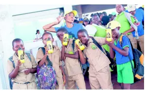  ??  ?? Students pose with water bottles at the Nuh Dutty Up Jamaica Road Code Link & Think event, held at the Half-Way Tree Transport Centre on November 30, 2017.