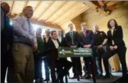  ?? TANIA BARRICKLO — DAILY FREEMAN ?? Governor Andrew Cuomo signs bill banning plastic bags in the state at the Hudson River Maritime Museum Monday afternoon on Earth Day.