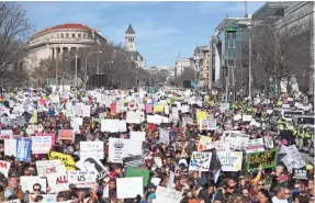  ?? JIM WATSON/AFP/GETTY IMAGES ?? Thousands of participan­ts fill Washington for the March For Our Lives rally on Saturday to demand stricter gun laws.