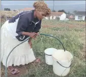  ??  ?? Nomusa Mkhize fetching water from a standpipe.