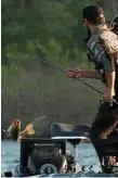  ?? Photo: Contribute­d ?? Carl Jocumsen reels in a catch during the Cherokee Casino Tahlequah Bassmaster Elite tournament.