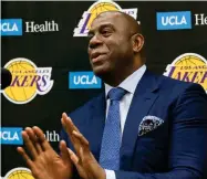  ?? DAMIAN DOVARGANES ?? Los Angeles Lakers president of basketball operations, Earvin "Magic" Johnson, takes questions from the media as he introduces the NBA teams draft picks in El Segundo, Calif., Tuesday, June 26, 2018. Magic Johnson is betting his job on his free-agent recruiting skills for the Los Angeles Lakers. Johnson says he will step down as the Lakers' president of basketball operations if he can't persuade an elite free agent to sign with his club within the next two summers.