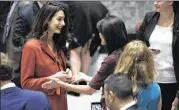  ?? MARY ALTAFFER / ASSOCIATED PRESS ?? Human rights lawyer Amal Clooney (left) speaks to U.S. Ambassador to the United Nations Nikki Haley before a Security Council meeting Thursday at United Nations headquarte­rs. Scott Shane and Mike Isaac