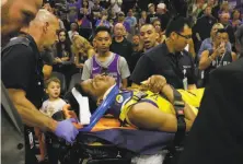  ?? Rich Pedroncell­i / Associated Press ?? Patrick McCaw, on being taken off the court on a stretcher after a scary fall, said all he could do was cry, pray and hope.