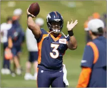  ?? DAVID ZALUBOWSKI — THE ASSOCIATED PRESS ?? Denver Broncos quarterbac­k Russell Wilson takes part in drills at the team’s voluntary minicamp last month at the team’s headquarte­rs in Englewood, Colo.