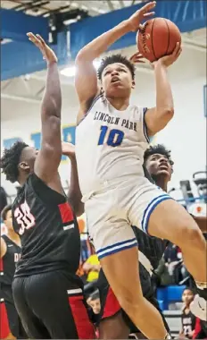  ?? Alexandra Wimley/Post-Gazette ?? Lincoln Park’s Andre Wilder drives to the basket against Aliquippa Tuesday night in a WPIAL Class 3A showdown.