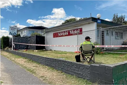  ?? ?? A security guard on site at the Adelphi Motel in Taupō where 30-year-old Ryan Whare Woodford was killed last Sunday morning.
Taupō woman