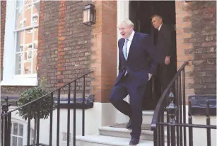  ?? (Hannah McKay/Reuters) ?? BORIS JOHNSON leaves his office in London yesterday after being announced as Britain’s next prime minister.