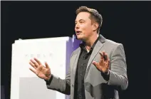  ?? DAVID MCNEW/AFP/GETTY IMAGES ?? Some investors worry that Tesla CEO Elon Musk’s involvemen­t in other projects will prove distractin­g and hurt the company. “He’s all over the map, from tunneling to flights to Mars to solar-roof tiles,” one said.