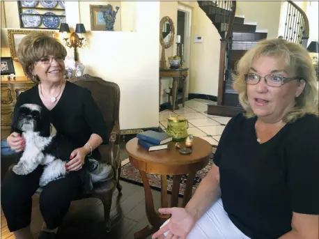  ?? MICHELLE L. PRICE — THE ASSOCIATED PRESS ?? Terrie Dietrich, left, and her daughter Erin Cross, talk in Dietrich’s home in Henderson, Nev., Thursday.