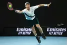  ?? Photograph: Clive Brunskill/Getty Images ?? Andy Murray stretches to play a forehand at Melbourne Park.