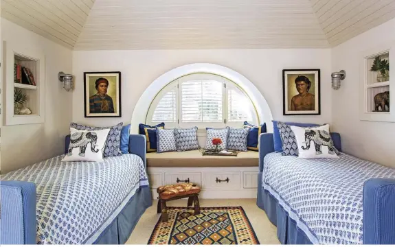  ??  ?? YOUNG AND CHIC. This bedroom, used primarily by the grandchild­ren, is one of Cameron’s favorite spots. “In lieu of bunk beds, we made custom twin beds with a trundle bed. The window seat is even large enough for sleeping!” Cameron says.