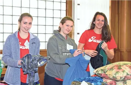  ?? COURTESY OF ST. AGNES ACADEMY-ST. DOMINIC SCHOOL ?? St. Agnes students recently participat­ed in the school’s 22nd annual Day of Caring. Activities included sorting clothing at Room at the Inn. They also tutored students at different schools throughout Memphis.