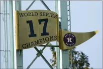  ?? DAVID J. PHILLIP — THE ASSOCIATED PRESS ?? The Houston Astros World Series banner is seen Monday in Houston. The Astros face the Atlanta Braves in Game 1of baseball’s World Series Tuesday.