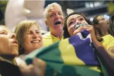  ?? AP ?? Supporter of Jair Bolsonaro celebrate the election results in Rio de Janeiro, Brazil, on Sunday.