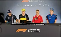  ?? GETTY IMAGES ?? Brendon Hartley, right, sits next to Sebastian Vettel at an F1 press conference.