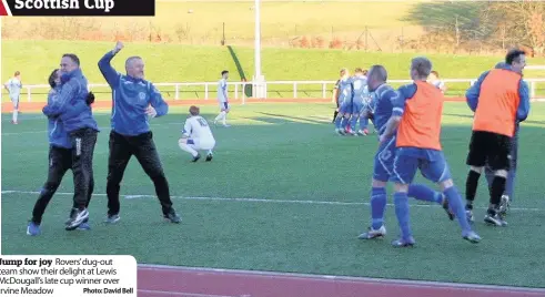  ??  ?? Jump for joy Rovers’ dug-out team show their delight at Lewis Mcdougall’s late cup winner over Irvine Meadow Photo: David Bell