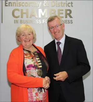  ??  ?? Outgoing president John Burke-O’Leary handing over the chain of office to new president Maree Lyng.