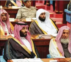  ??  ?? In this photo provided by the Saudi Press Agency, SPA, Crown Prince Mohammed bin Salman (front row on left) seated next to the country’s most senior cleric, listens to Saudi King Salman give his annual policy speech in the ornate hall of the consultati­ve Shura Council, on Monday, Riyadh, Saudi Arabia. AP PHOTO/SAUDI PRESS AGENCY