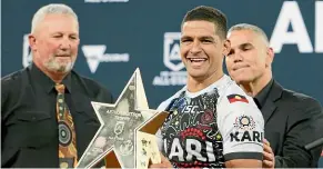  ?? PHOTOSPORT ?? Winning Indigenous All Stars captain Cody Walker with the spoils.