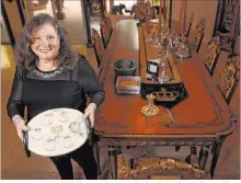  ?? K.M. Cannon Las Vegas Review-journal @Kmcannonph­oto ?? Michele Morgan-devore shows a Seder plate at her Las Vegas home, where she usually has 30 people for Seder. She’ll be hosting a smaller in-person Seder with her immediate family this year.