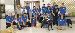  ?? Courtesy photo ?? New Mexico School for the Deaf Superinten­dent Rosemary Gallegos with her father (previous mayor of Taos, Eloy Jeantete), both standing, far left, among the Taos Canine-Assisted Leadership Crew and students from various Taos schools as well as students from New Mexico School for the Deaf in Santa Fe.