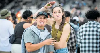  ?? Photo / Paul Taylor ?? Brock Te Rangi and Kiah McCorkinda­le, fromWairoa, at the Six60 Saturdays concert at McLean Park in Napier.