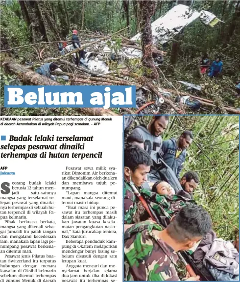  ?? - AFP - AFP ?? KEADAAN pesawat Pilatus yang ditemui terhempas di gunung Menuk di daerah Aerambakon di wilayah Papua pagi semalam. ANGGOTA penyelamat mengusung seorang budak lelaki yang ditemui selamat selepas pesawat yang dinaikinya terhempas kelmarin.