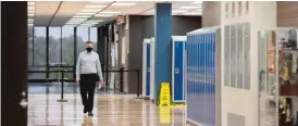  ?? PAT NABONG/SUN-TIMES FILE ?? Assistant Principal Matthew Swanson walks inside Whitney Young Magnet High School in September 2020.