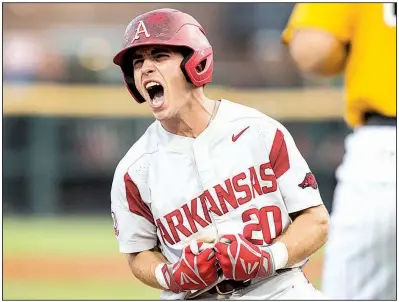  ?? NWA Democrat-Gazette/BEN GOFF ?? Arkansas’ Carson Shaddy celebrates after hitting a two-run triple in the second inning of Saturday night’s game against Southern Miss at the NCAA Fayettevil­le Regional. The Razorbacks scored seven runs in the inning and advanced to tonight’s regional final.