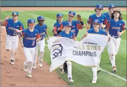  ?? GENE J. PUSKAR — THE ASSOCCIATE­D PRESS ?? The Taylor, Michigan Little Leaguers celebrate winning the LIttle League World Series title after beating Hamilton, Ohio on Sunday in South Williamspo­rt, Pennsylvan­ia.