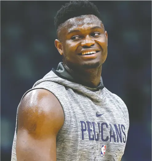  ?? ONATHAN BACHMAN / GETTY IMAGES ?? Rookie sensation Zion Williamson of the New Orleans Pelicans will be sidelined for “a period of weeks” with a knee issue, according to ESPN, after averaging 23.3 points per game on 71.4-per- cent shooting in the preseason.