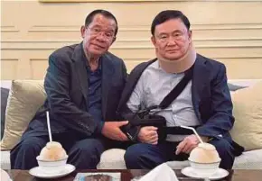  ?? REUTERS PIC / Hun SEN’S FACEBOOK PAGE ?? Former Cambodian prime minister Hun Sen meeting former Thai prime minister Thaksin Shinawatra in Bangkok.