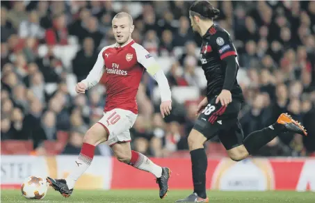  ??  ?? England midfielder Jack Wilshere takes on AC Milan in Arsenal’s Europa League victory last midweek.