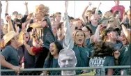  ?? MARK HUMPHREY ENTERPRISE-LEADER ?? Prairie Grove fans go into a frenzy celebratin­g a touchdown pass by quarterbac­k Zeke Laird against rival Farmington Friday. The Tigers beat the Cardinals 35-14 behind Laird’s four touchdown passes.