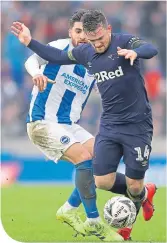  ??  ?? Derby’s Jack Marriott is challenged by Alireza Jahanbakhs­h