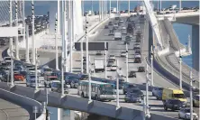  ?? Paul Chinn / The Chronicle ?? Traffic on the westbound lanes of the Bay Bridge in January, before the pandemic sharply reduced commuter traffic.