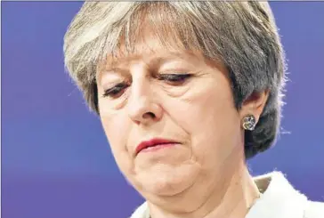  ?? EMMANUEL DUNAND/AFP ?? British Prime Minister Theresa May looks down as she addresses a press conference with the European Commission president at the European Commission in Brussels on December 8.