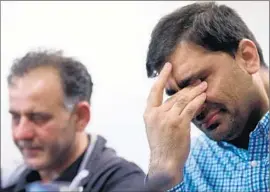  ?? Paul Ellis AFP/Getty Images ?? AKHTAR IQBAL, left, and Mohammad Shoaib said their lives were shattered when their families failed to return from a religious pilgrimage to Saudi Arabia.