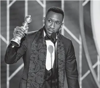  ?? Paul Drinkwater / Associated Press ?? Mahershala Ali accepts the award for best supporting actor in a motion picture for his role in “Green Book.”