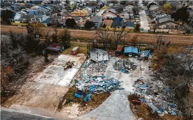  ?? Mark Mulligan / Staff photograph­er ?? Debris is piled up near the former Watson Grinding & Manufactur­ing facility, the site of an explosion last January.