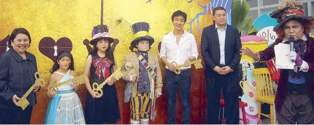  ??  ?? Opening the Sky Park are Marissa Fernan, VP of SM Prime Holdings, Inc.; Ambra Anzani; Sabi Fernan; Jack Booth; Kenneth Cobonpue; Jonjon Agustin, SVP for marketing of SM Supermalls; and the Mad Hatter host, Billy Sienes