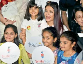  ??  ?? Aishwarya Rai with daughter Aaradhya at an event where she announced her intention to sponsor cleft- lip surgeries for kids