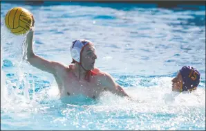  ?? DAVID WITTE/NEWS-SENTINEL ?? Above: Lodi's Victor Plunkett takes a shot during Lodi's victory over Tokay on Thursday at Tokay High. Below: Tokay's Nic Hillary advances to the net during Thursday's loss to Lodi's Matt Marini, part of a 6-3 Tokay loss at Tokay High.