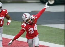  ?? JAY LAPRETE — THE ASSOCIATED PRESS ?? Ohio State defensive back Shaun Wade celebrates his intercepti­on and touchdown against Indiana during the second half last Saturday in Columbus, Ohio.